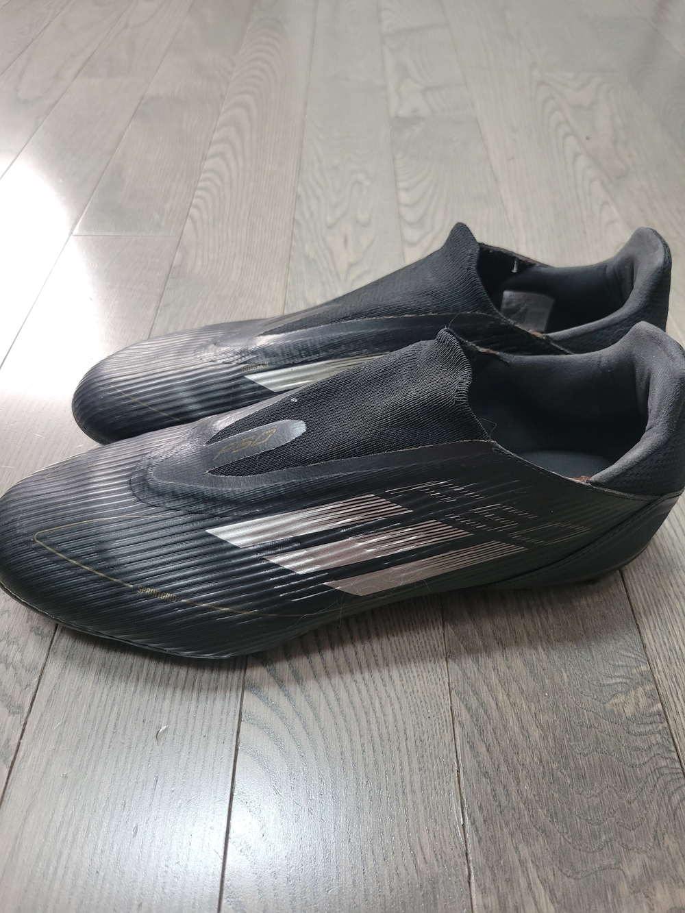 adidas Black Athletic Soccer Shoes with Silver Stripes